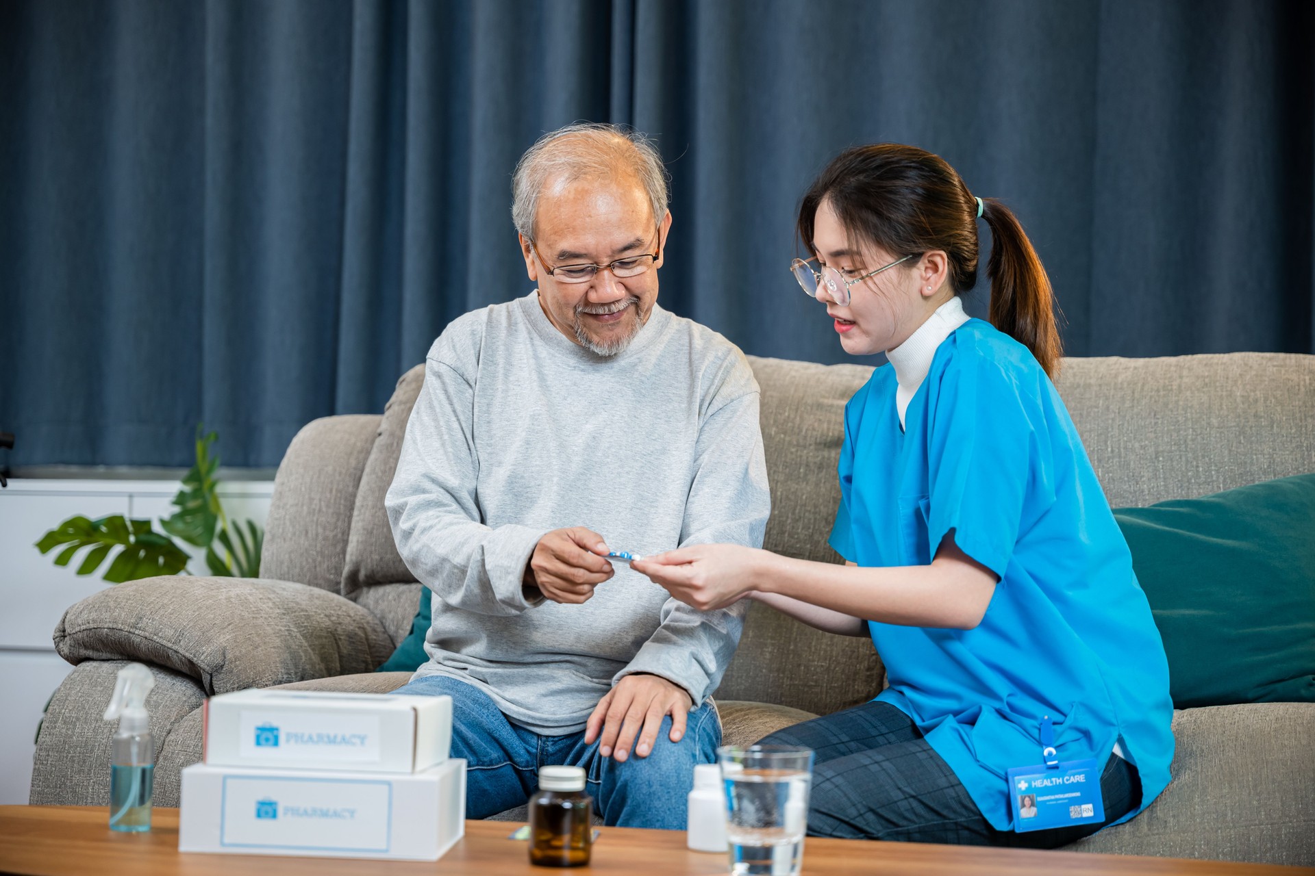 Asian doctor with physician visit senior male patient consult medicine dosage at house